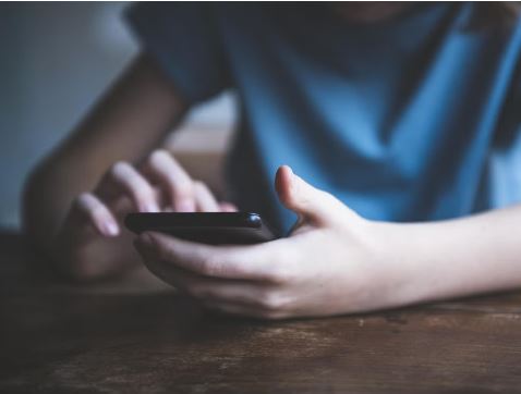 BOY USING PHONE